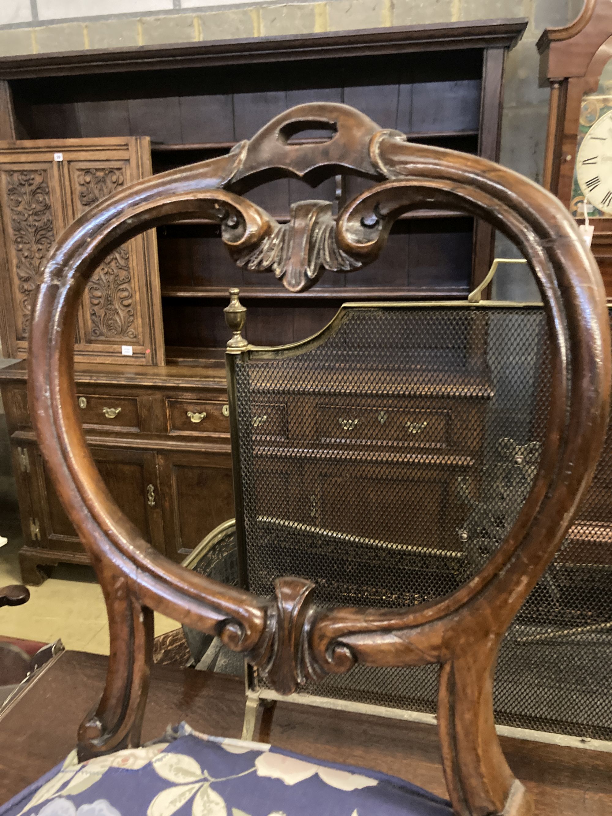 A set of six Victorian balloon back rosewood dining chairs